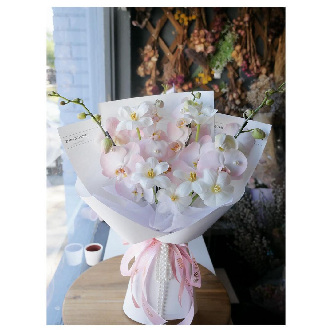 Orchids are exotic, intricate flowers known for their diverse patterns, vibrant colors, and long-lasting blooms, symbolizing elegance and rare beauty.