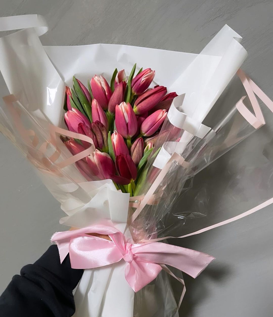 Tulips are vibrant, elegant flowers with smooth, cup-shaped blooms that come in a variety of colors, symbolizing perfect love and renewal.