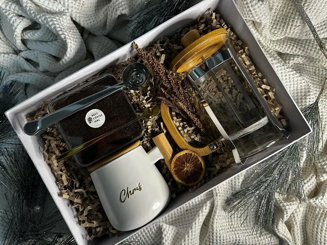 Gift box with coffee, tea, and a mug - perfect for coffee lovers.