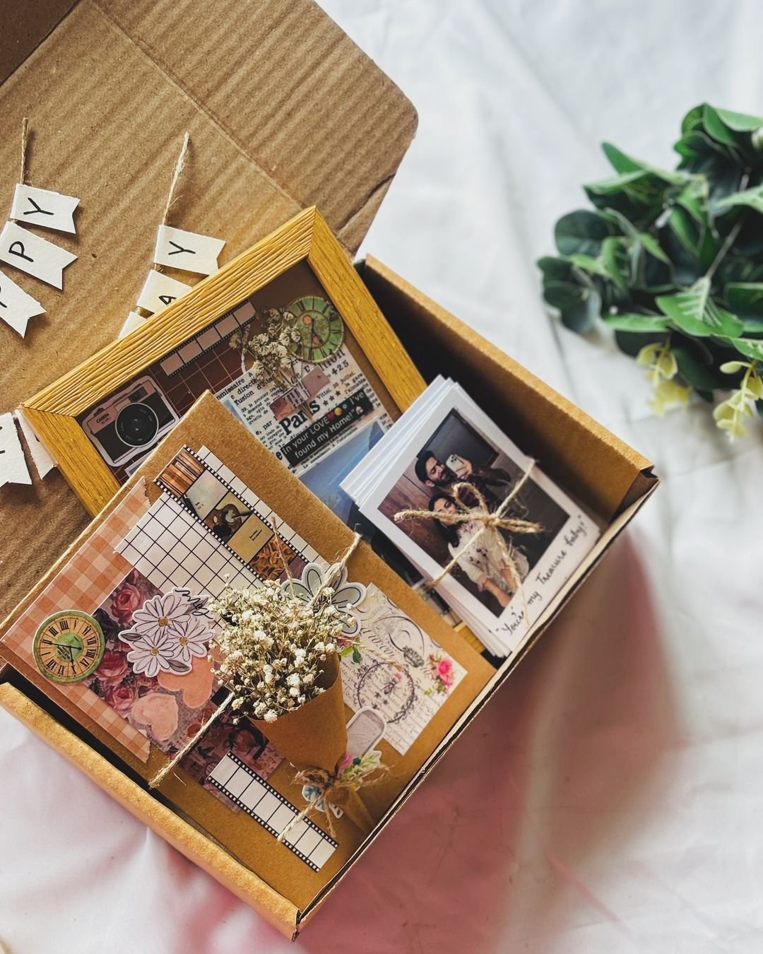 Decorative photo frame box with floral design.