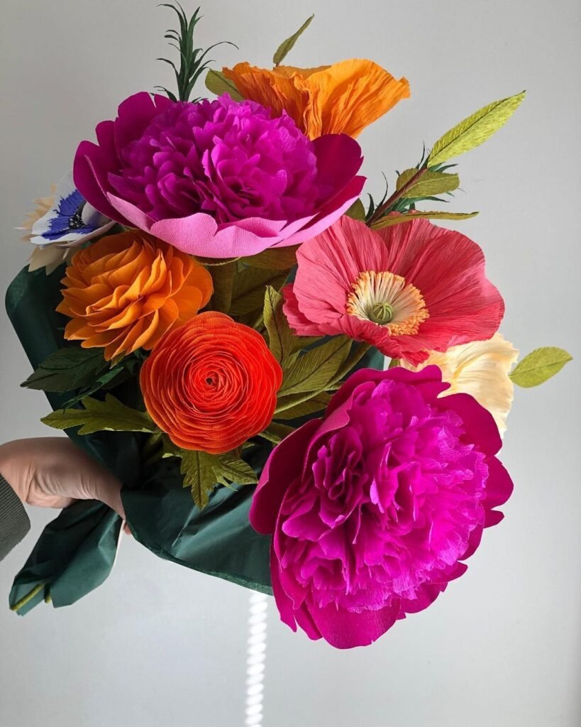 Paper flowers are handcrafted blooms made from various types of paper, designed to mimic real flowers with customizable colors and shapes for unique and artistic arrangements.