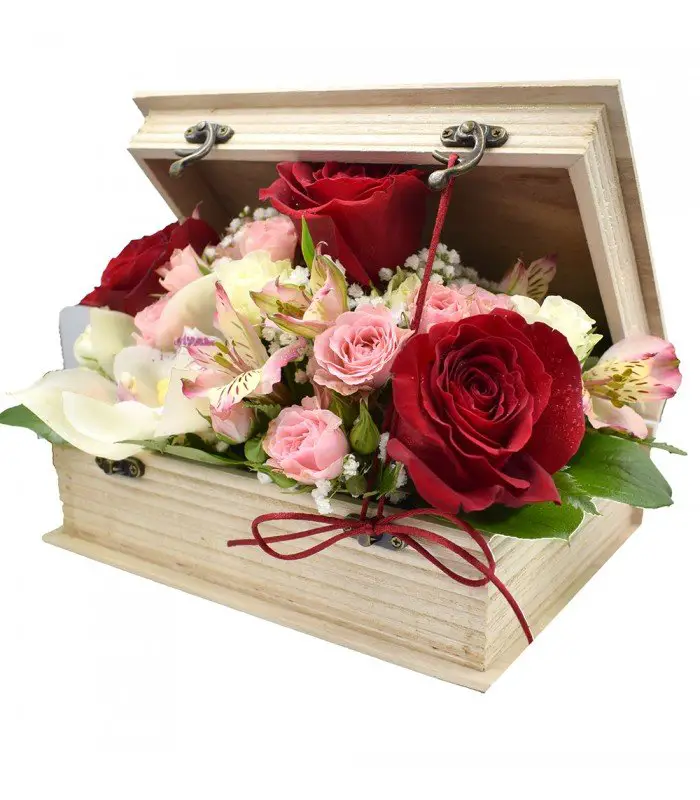 A rustic wooden box brimming with colorful flowers, reflecting the enchanting essence of storybook flower arrangements.