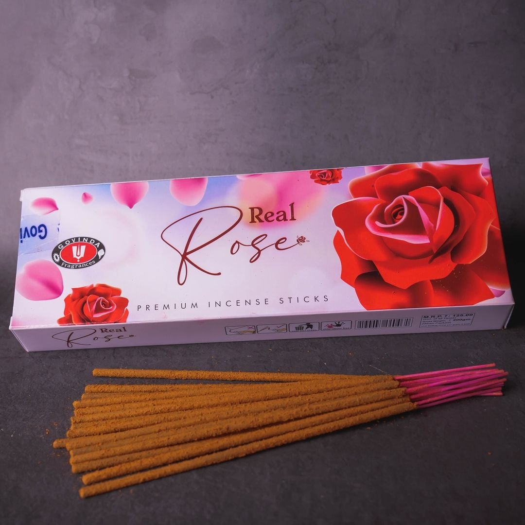 A close-up of real rose incense sticks, showcasing their delicate floral design and rich, aromatic essence.
