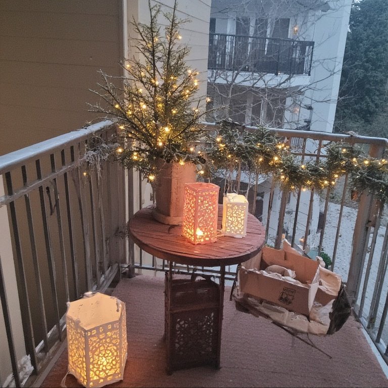20 Christmas Balcony Decoration Ideas to Create a Festive Escape 4 Place a few battery-operated LED lanterns on a small table or the floor. You can find festive styles at most home goods stores. They add a cozy, flickering light without any fire risk.